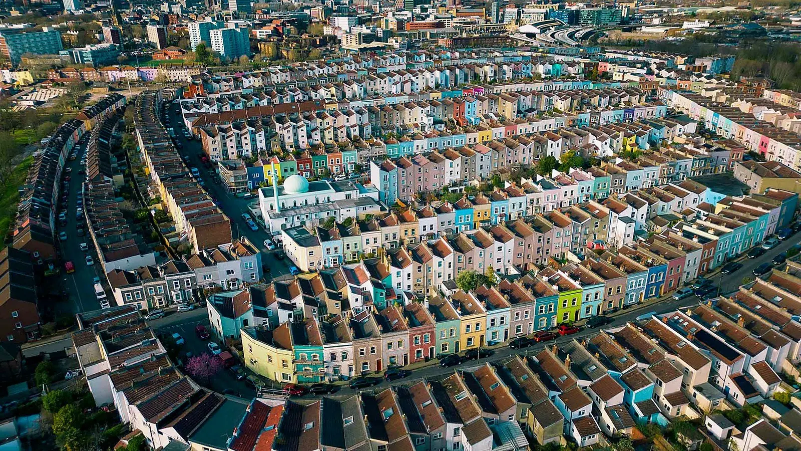 Aerial view of Bristol's coloured terraced houses, the homes where owners weigh up whether to renovate or move house