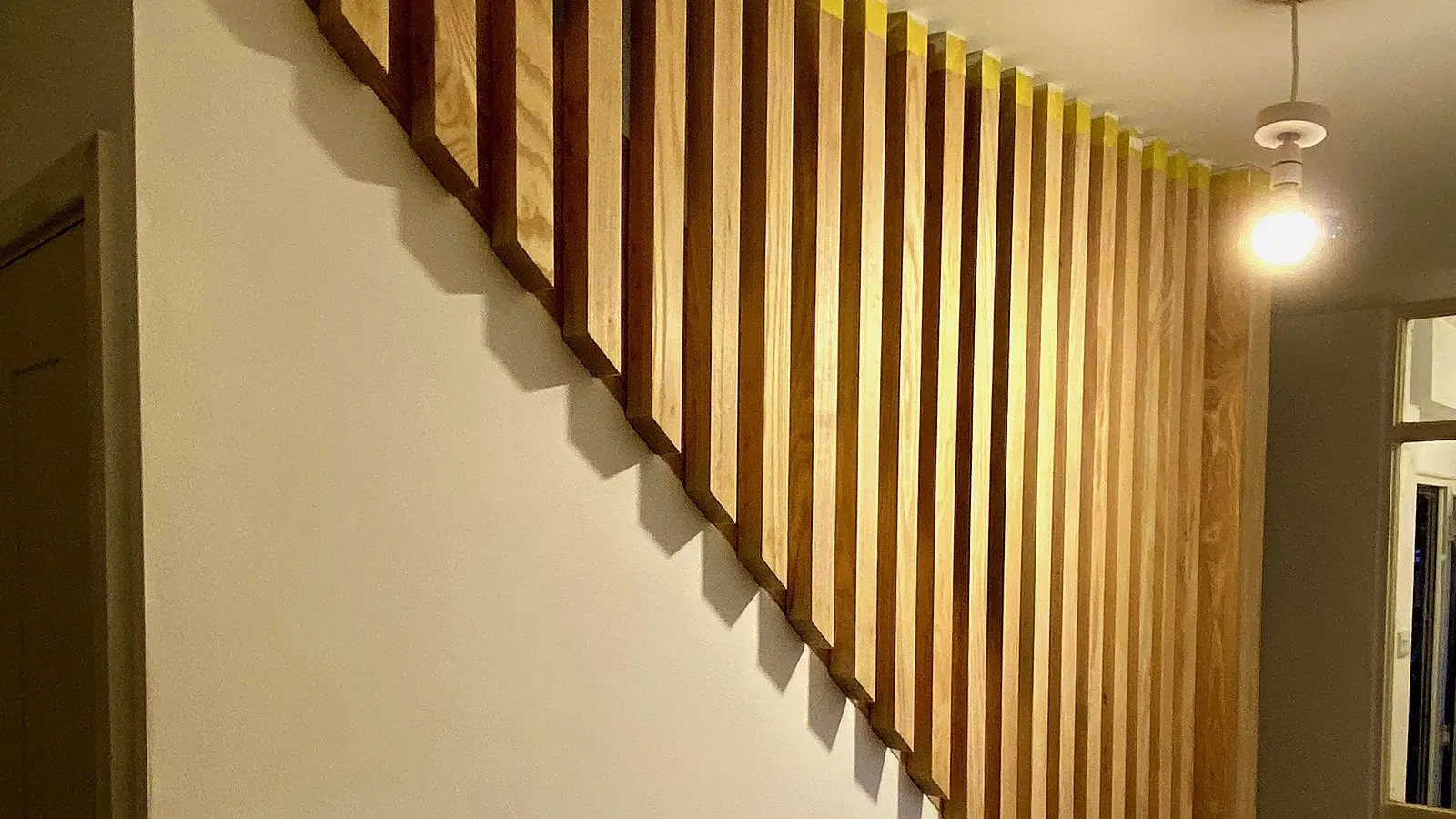 Slatted oak staircase built by our carpenters in a Bristol home: the joinery standard we bring to loft conversion stairs