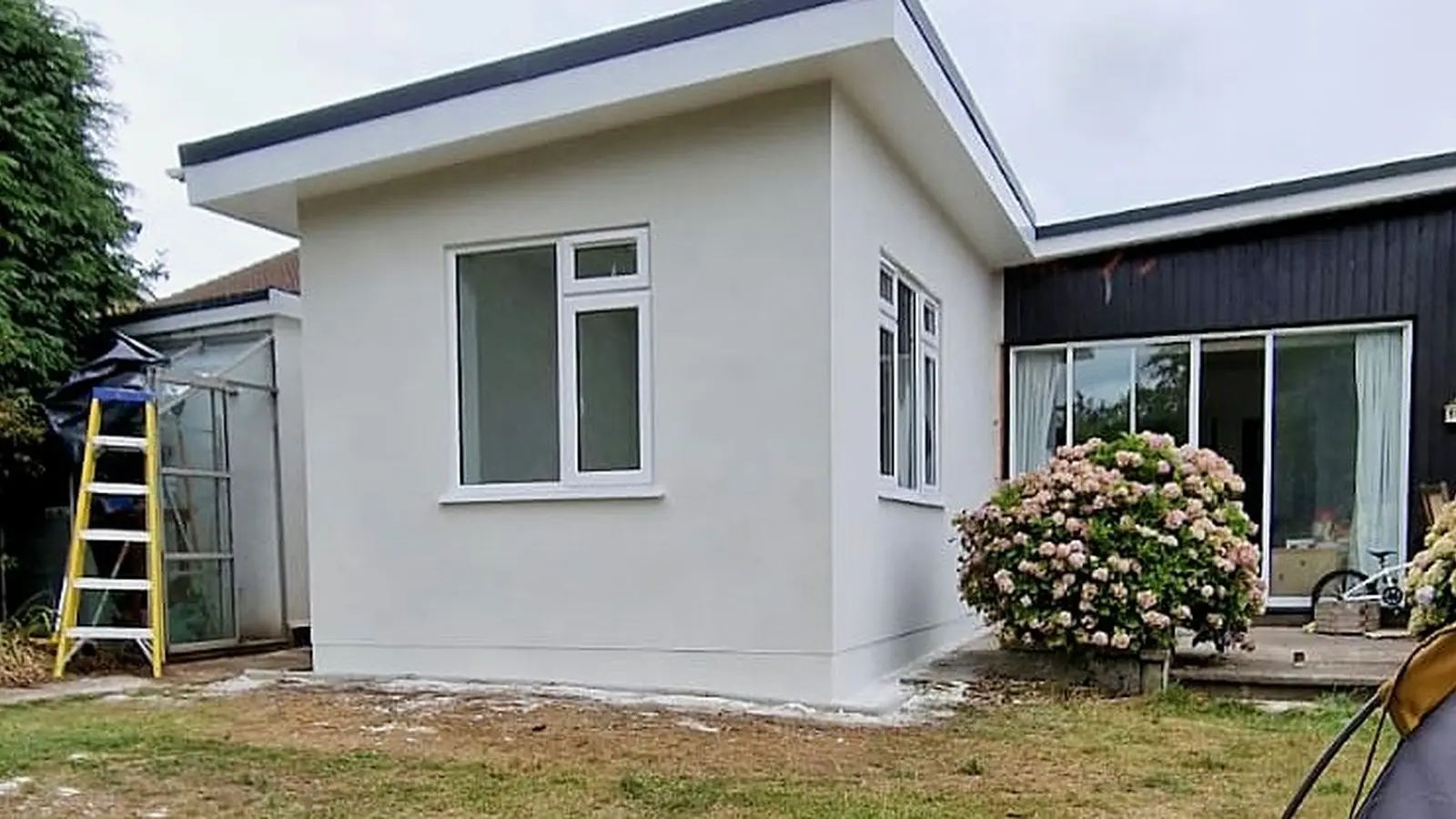 White rendered flat-roof rear extension by Wilson & Cole in Bristol, one side of the loft conversion or extension decision