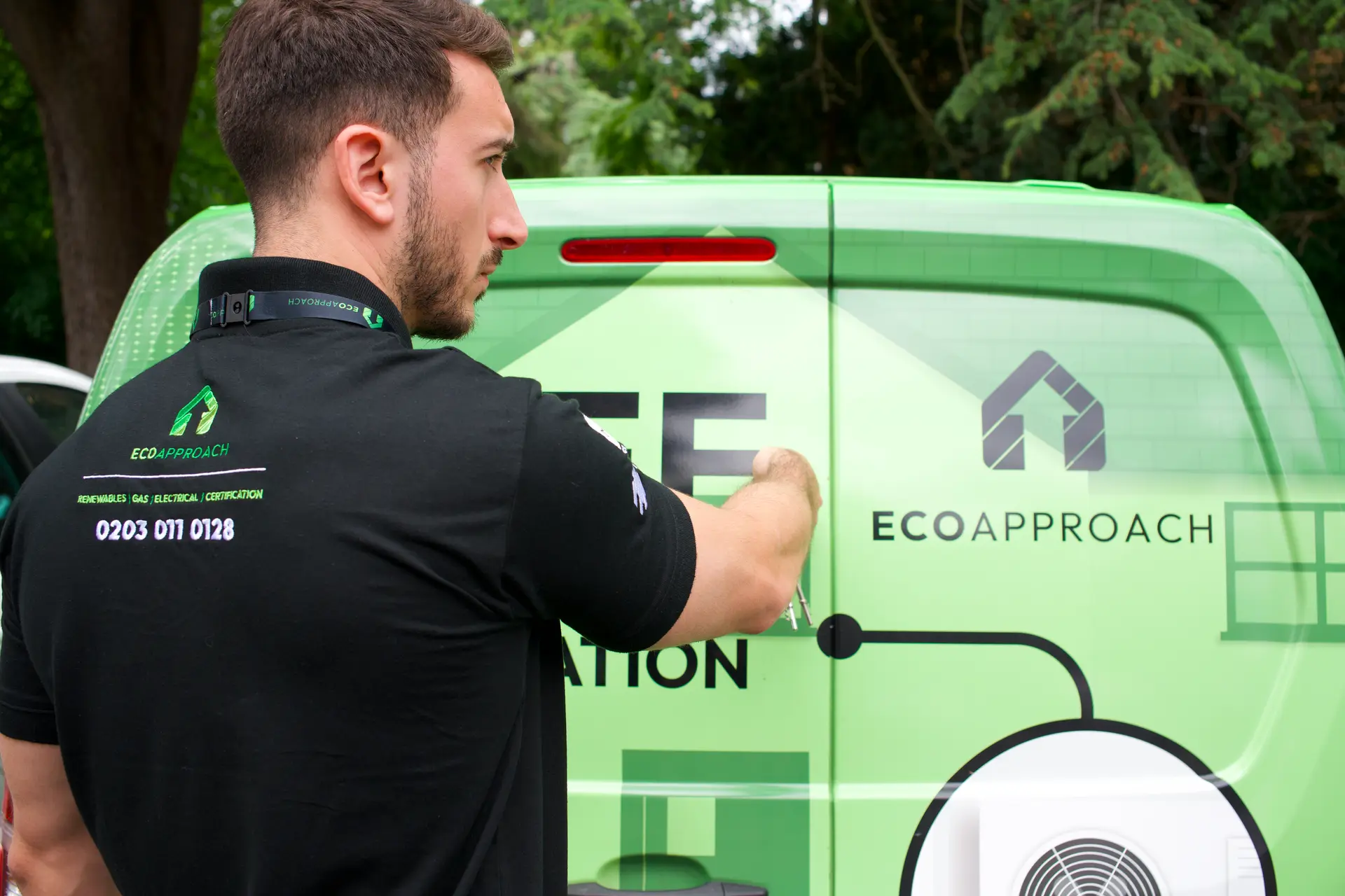 An Eco Approach engineer beside a branded van