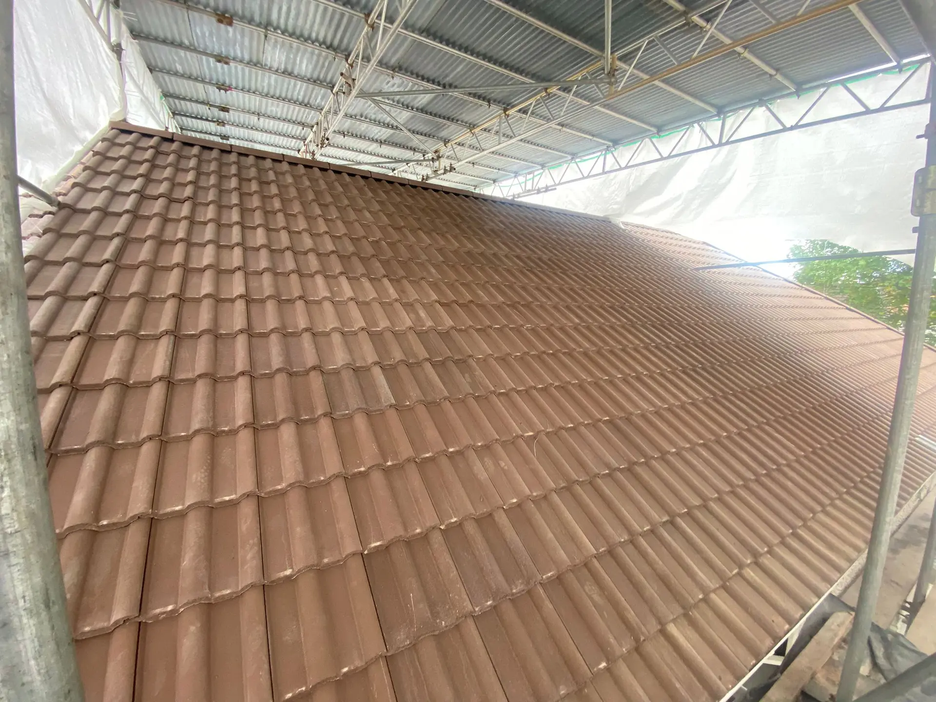 Newly tiled roof in brown double roman tiles
