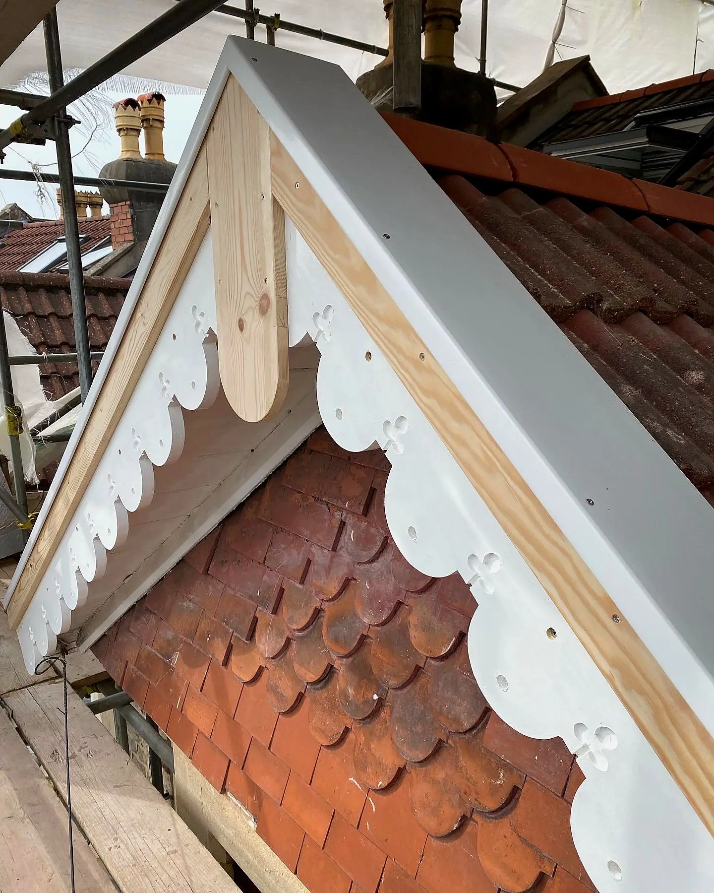 Decorative shingle gable rebuilt and finished