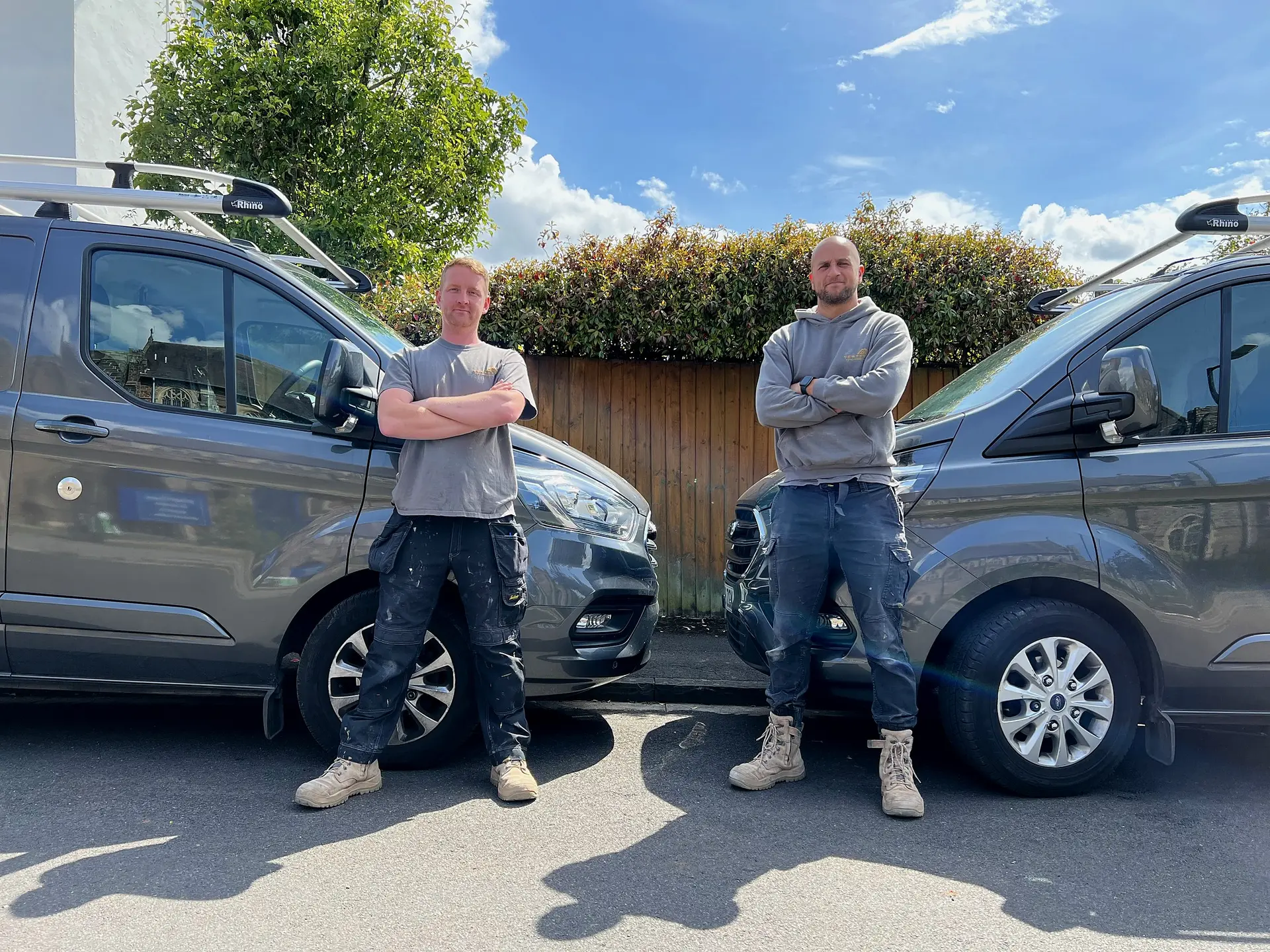 Daniel Webster and Craig Cook of Wilson & Cole Developments beside their vans