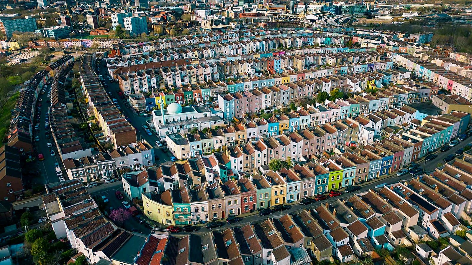 Aerial view of Bristol's coloured terraced houses, the homes where owners weigh up whether to renovate or move house