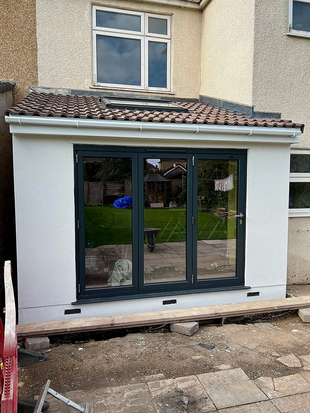 Rear kitchen extension under construction in Bristol with anthracite bifold doors in place