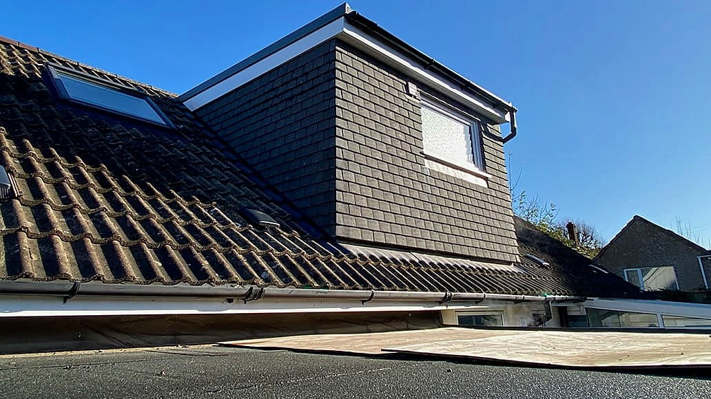 Slate-clad rear dormer loft conversion in Bristol built by Wilson & Cole Developments