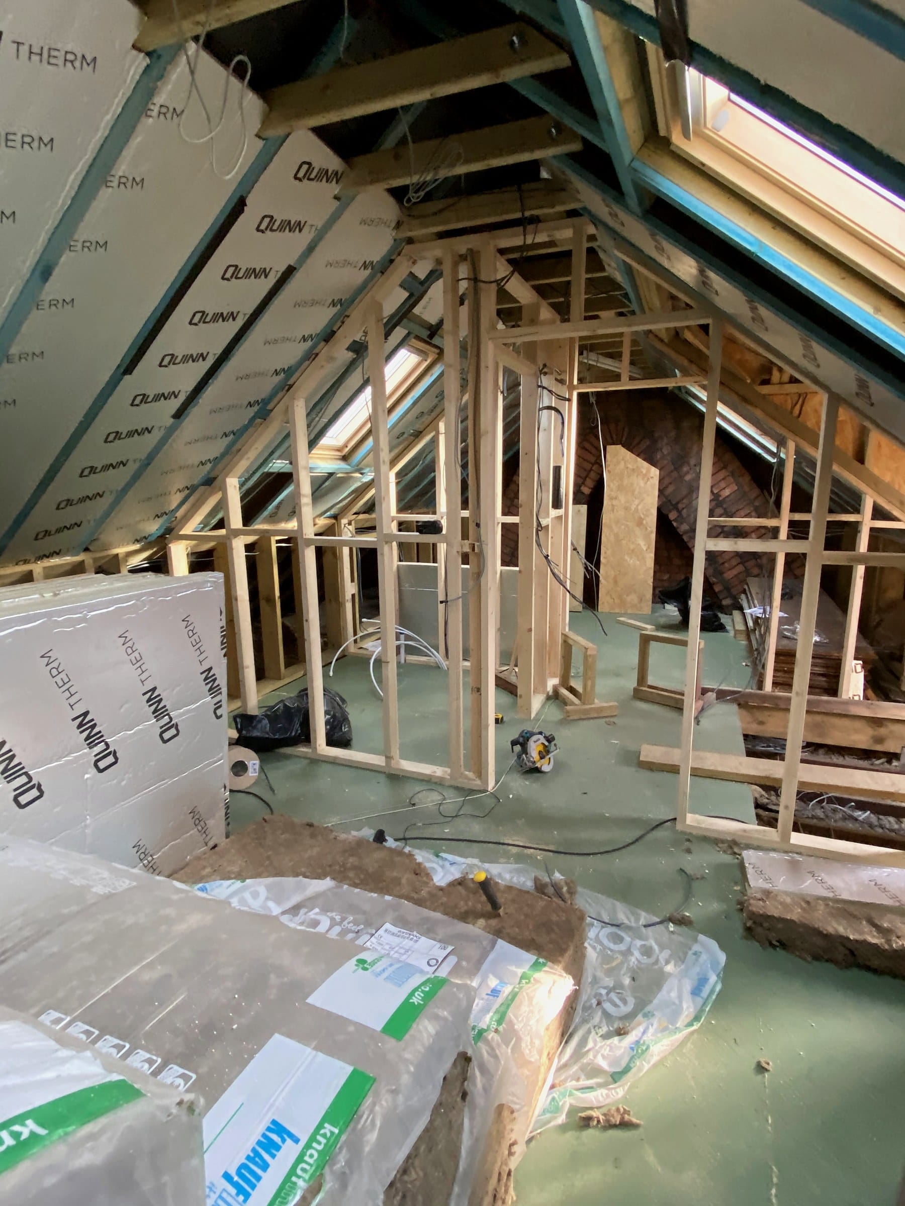 Studwork and insulation inside a loft conversion on a Wilson & Cole site in Bristol